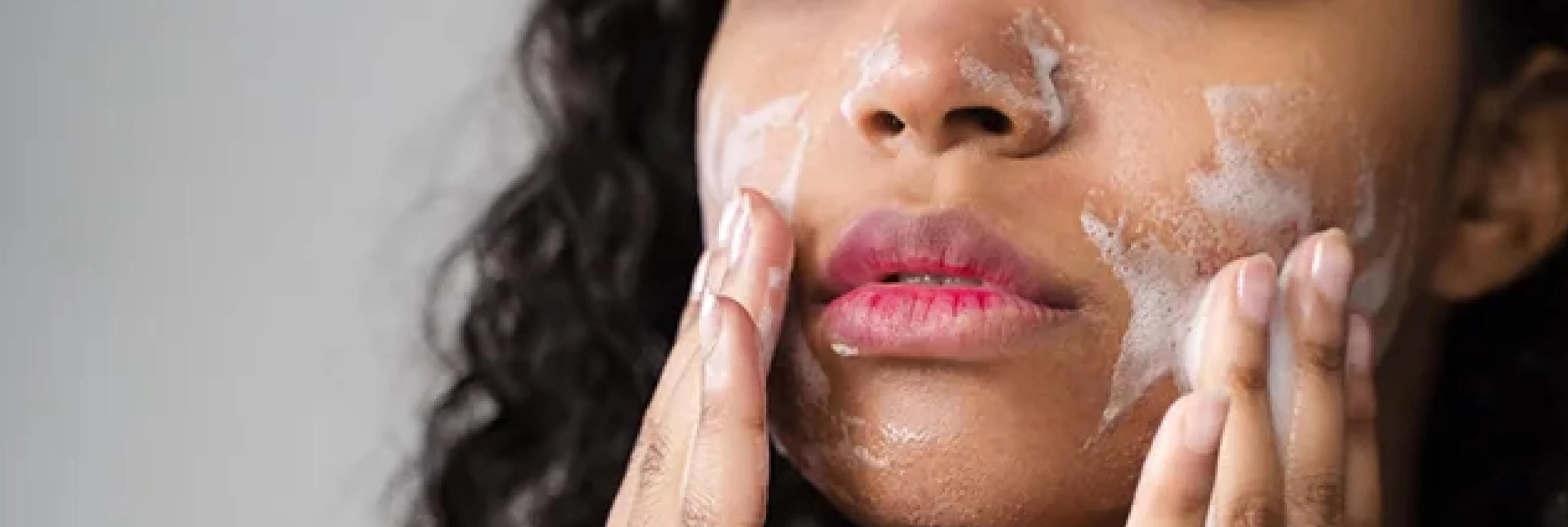 Skincare model holding muslin cloth in hands