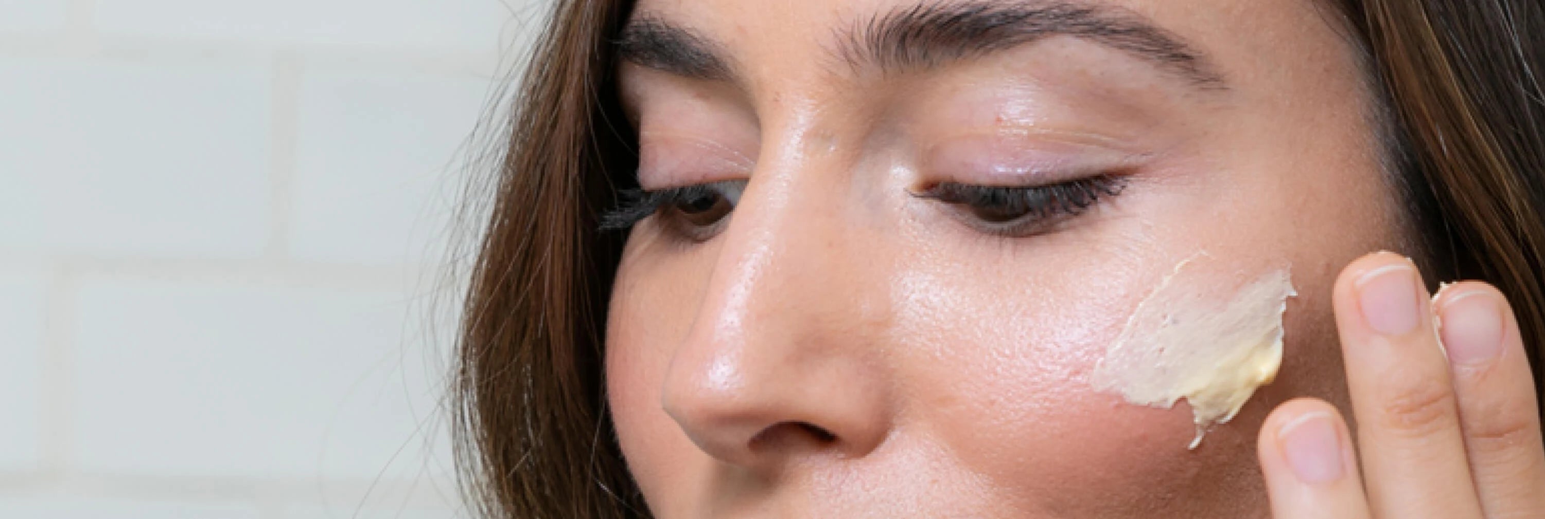 Skincare Model Applying Synergie Skin's ReClaim