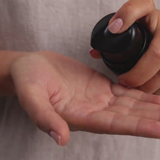 Skincare model is applying TriDration B to face