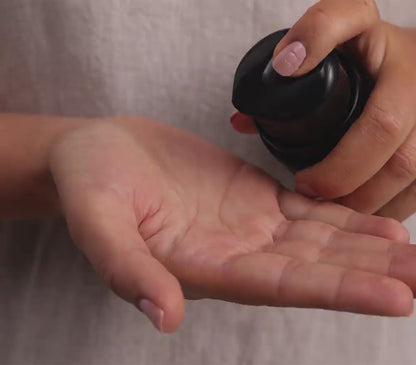 Skincare model is applying TriDration B to face